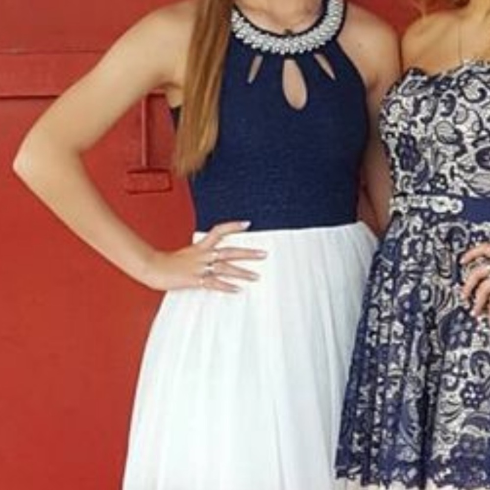 Dress on the left with blue bodes and white skirt with pearl neckline